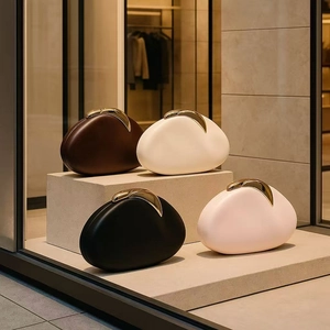 Chic pebble-shaped PU leather clutch bags with golden crescent clasps in four colors