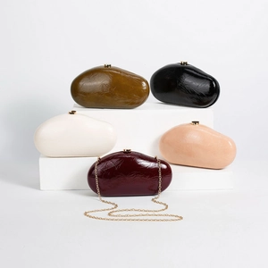 Modern pebble-shaped PU clutches in five colors with sleek gold hardware and chain straps