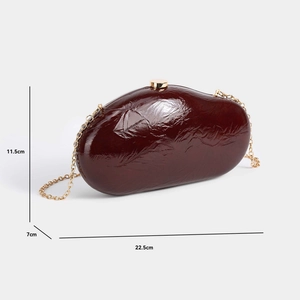 Detailed size view of a burgundy pleated evening clutch bag with golden chain strap