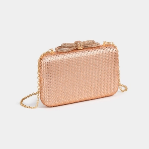 Detailed close-up of rose gold rhinestone evening bag with sparkling bow clasp and chain
