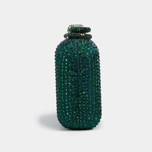 Detail shot of an emerald green cylindrical clutch bag with dense rhinestone embellishments