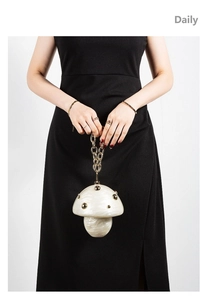 Creative mushroom-shaped acrylic evening clutch with pearlescent finish and gold studs