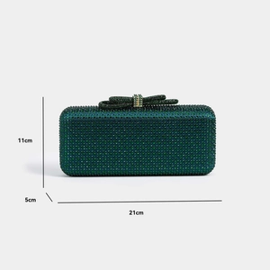 Macro shot of green rhinestone evening clutch showing dimensions 21cm x 11cm x 5cm