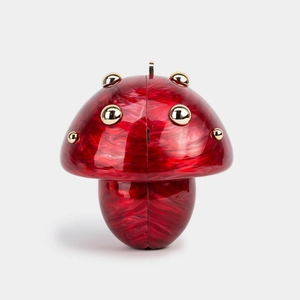 Detail of red marble acrylic mushroom evening clutch with gold metallic rivets