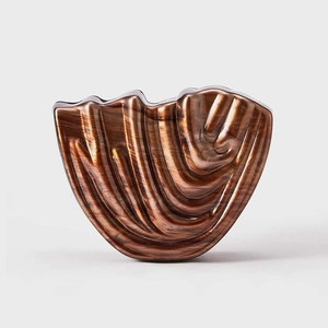 Fashionable amber acrylic hair claw clip with a wavy pattern and high-gloss finish