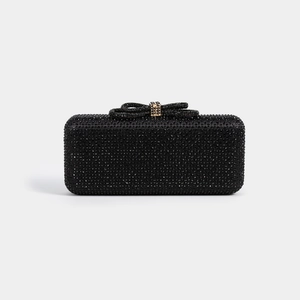 Elegant black evening clutch bag with sparkling rhinestones and a metal bow ornament