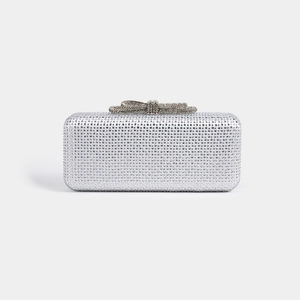 Detail of crystal evening clutch bag with rhinestone bow clasp for party and wedding