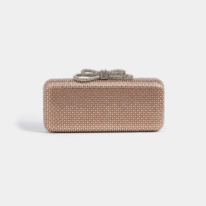Detail showing crystal bow clasp and sparkling rhinestone surface on evening clutch