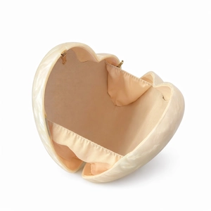 Elegant ivory marble acrylic heart-shaped evening clutch bag with golden metal hinges