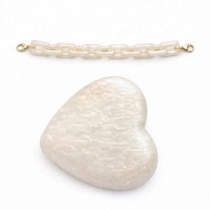 Elegant heart-shaped acrylic evening clutch bag with pearl marble texture and chain