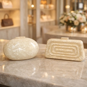 Elegant ivory marble acrylic clutch bags in oval and rectangular shapes for weddings