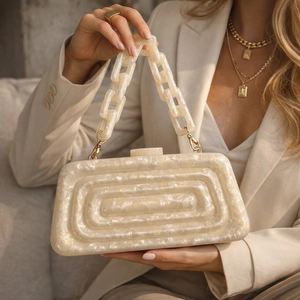 Elegant ivory acrylic evening bag with marble texture and chain strap for weddings