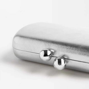 Silver lychee grain leather clutch bag with elegant double spherical metal clasp