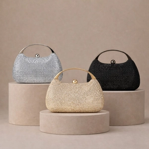 Close-up of sparkling rhinestone evening clutch bags in silver, gold, and black colors
