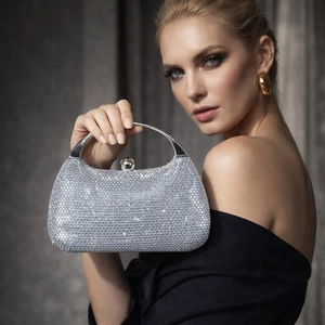 Elegant silver rhinestone evening bag with round metal handle for formal parties