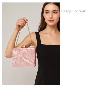 Detail of pink marble acrylic clutch bag with gold spherical clasp and metal chain