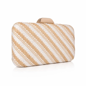 Detail of woven straw clutch with diagonal texture and gold metal clasp closure