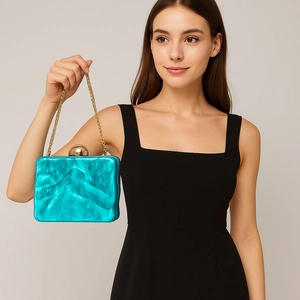 Teal marble acrylic evening clutch bag with gold spherical clasp and chain strap