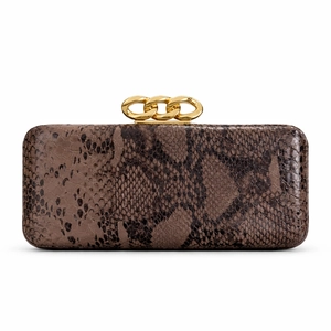 Detail of snake-embossed clutch bag featuring three decorative gold chain top clasps
