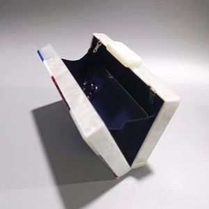 Elegant white marble acrylic evening clutch bag with red and blue accents and chain strap