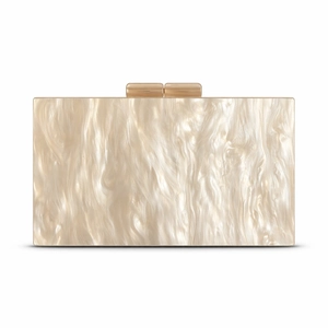 Detail of ivory marble acrylic clutch featuring elegant gold dual magnetic top closures