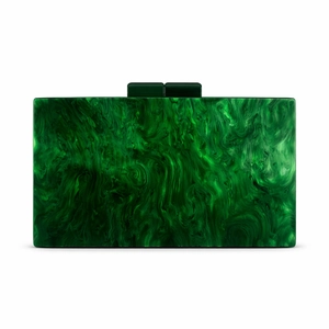 Macro view of emerald green marble texture and acrylic clasp on the evening bag