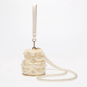 Exquisite pearl beaded white acrylic shell bag for weddings with marble texture details