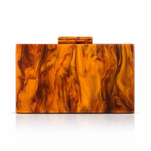 Detailed macro view of amber marble acrylic clutch bag with artistic resin texture