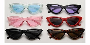 Detailed flat lay of triangle cat-eye sunglasses in multiple stylish color variations