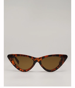 Detail view of vintage cat-eye sunglasses with tortoiseshell frame and dark brown lenses