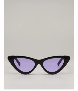 Detail of vintage cat-eye sunglasses with thick black frames and purple lenses