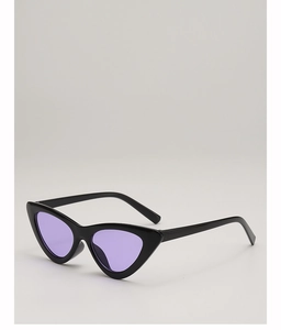Detail view of vintage cat-eye sunglasses with black frames and purple lenses for women