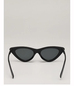 Close-up of retro black cat-eye sunglasses featuring a sleek triangular frame design