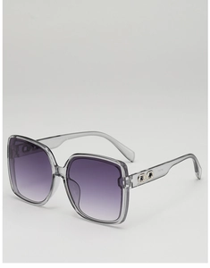 Close-up of square sunglasses with gradient purple lenses and silver metal trim
