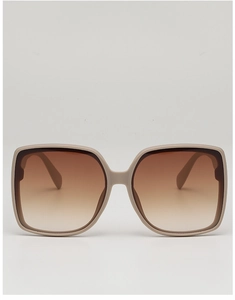 Front view of beige oversized square sunglasses with brown gradient lenses