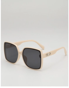 Detail of beige square oversized sunglasses with silver interlocking metal on temple