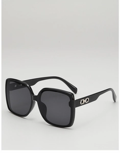 Close-up of black square sunglasses with silver chain link metal detail on the temple