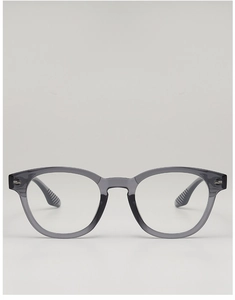 Detail of retro round grey translucent frames with vintage metal rivets and fine finish