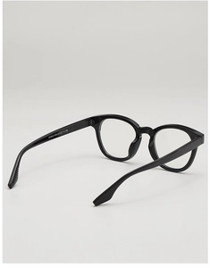 Detail shot of black retro round eyeglass frame featuring ZN3902 model specifications