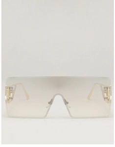 Detail view of oversized rimless square sunglasses with gold hollow metal hinge design