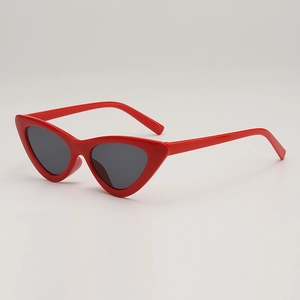 Retro red cat-eye sunglasses with thick frames and dark lenses for a vintage fashion style