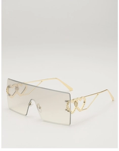 Detail of gradient grey rimless sunglasses with gold heart-shaped metal temple joints