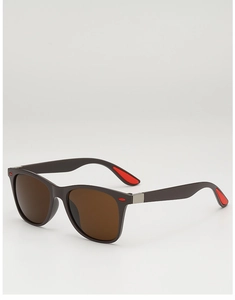 Détail de lunettes de soleil carrées avec coussinets rouges et charnières métalliques