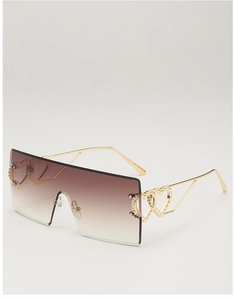Detail view of oversized rimless square sunglasses featuring golden heart hollow metal hinges