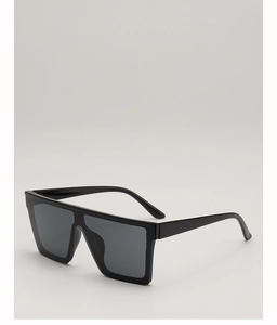Detail view of large square flat top sunglasses with glossy black frame and dark grey lenses