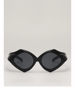 Detailed view of geometric black sunglasses with thick frames and dark grey lenses