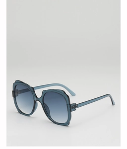 Detail of grey-blue translucent frames and dark blue gradient lenses on sunglasses
