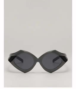 Detail view of bold geometric oversized sunglasses with chunky frames and dark lenses