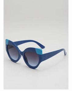 Detail of blue cat-eye sunglasses with contrast blue accents and gradient lenses