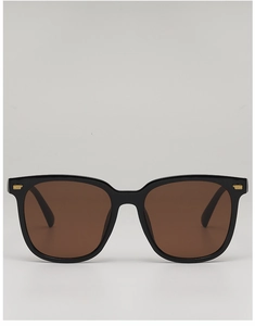 Front view of square black sunglasses featuring signature gold metal bar accents on frames